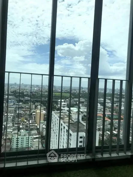 Stunning cityscape view from high-rise balcony with expansive skyline.