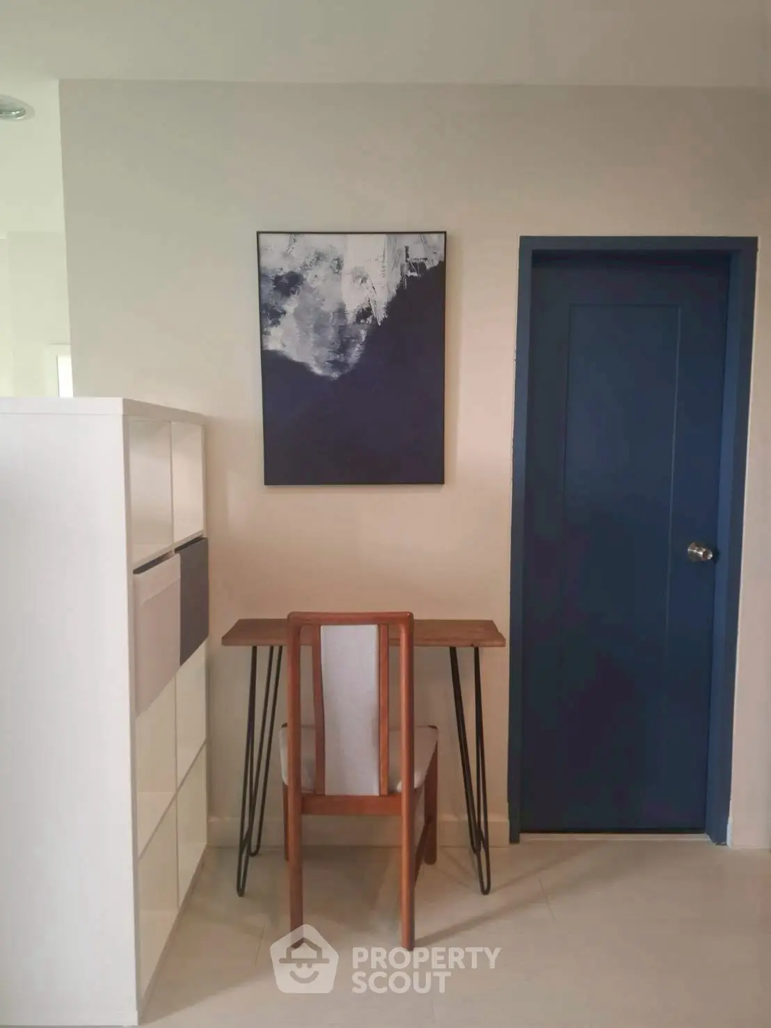 Stylish study nook with modern desk and chair in minimalist home interior.