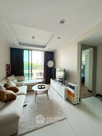Spacious modern living room with large windows and stylish decor