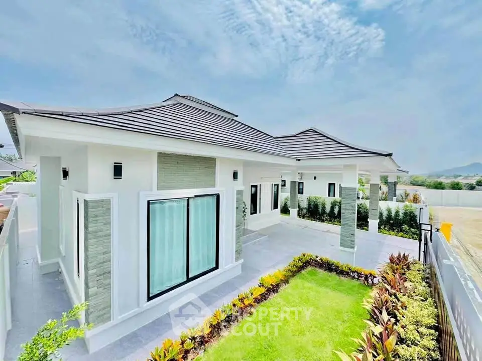 Stunning modern bungalow with lush garden and mountain views