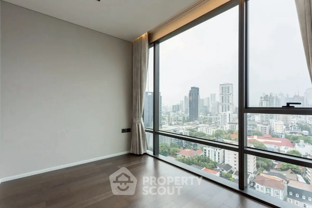Spacious corner unit with floor-to-ceiling windows offering a stunning city view.
