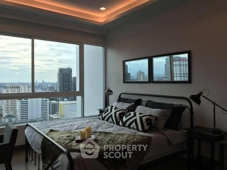 Modern bedroom with stunning city view and stylish decor