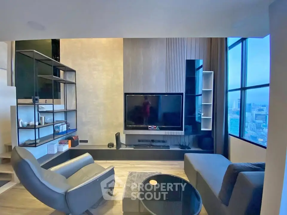 Modern living room with city view, sleek furniture, and large TV setup.