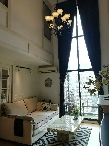 Elegant living room with high ceiling and large window offering city view