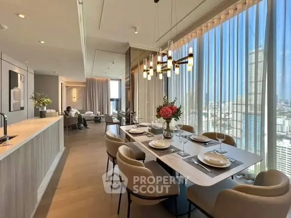 Luxurious open-plan living and dining area with stunning city views and elegant decor.
