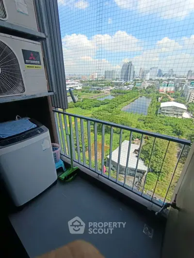 High-rise balcony with washing machine and stunning city view