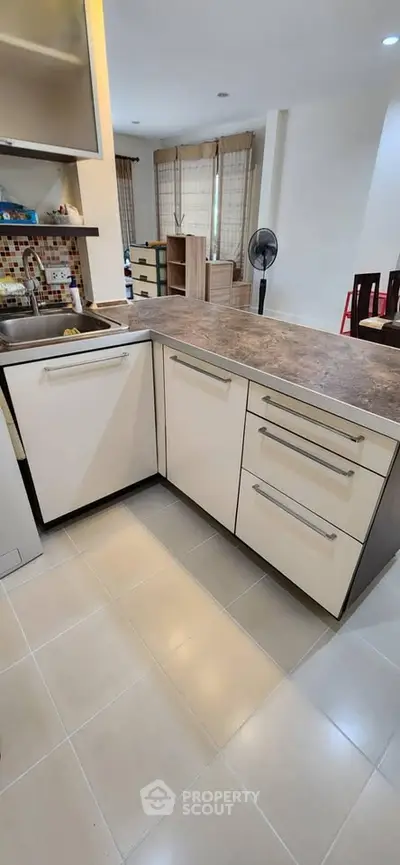 Modern kitchen with sleek cabinetry and spacious countertop