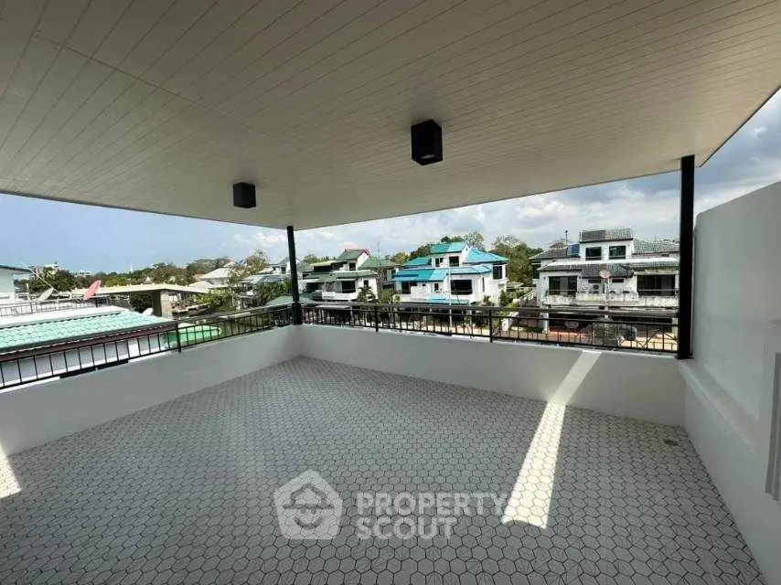 Spacious rooftop terrace with panoramic neighborhood views and modern design.