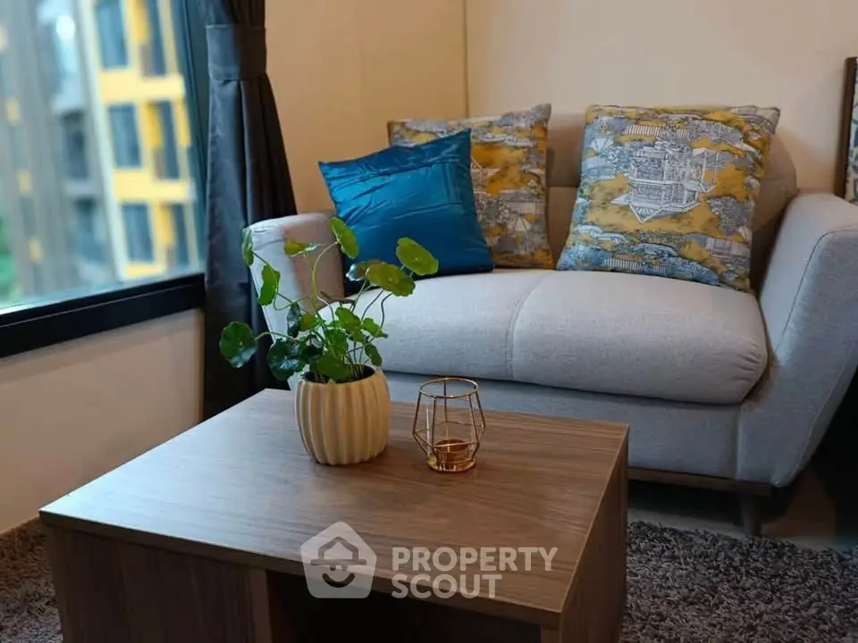 Cozy living room with stylish sofa and coffee table, perfect for relaxation.