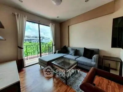 Modern living room with balcony view and stylish furniture