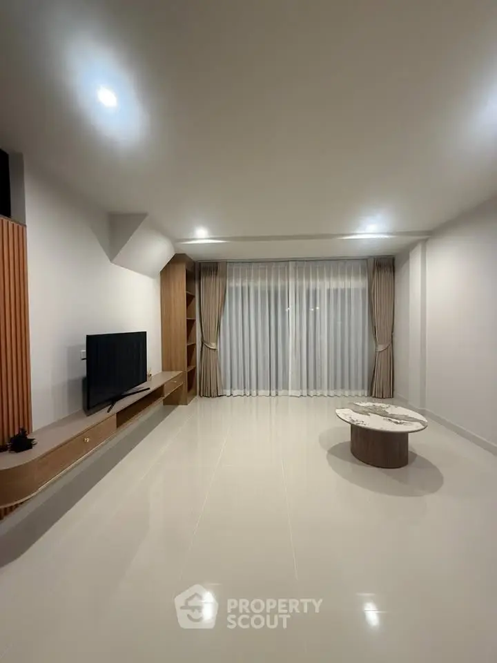 Spacious modern living room with sleek design and natural light