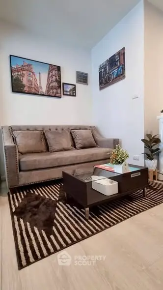 Stylish living room with modern sofa and chic decor in a cozy apartment setting.