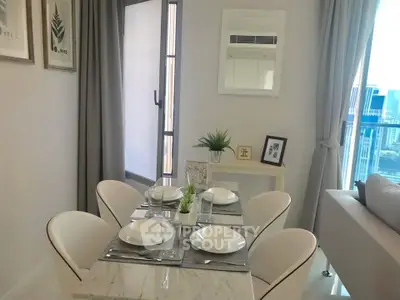 Modern dining area with elegant table setting and city view, perfect for urban living.