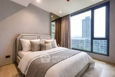 Luxurious bedroom with modern decor and large windows offering stunning city views.