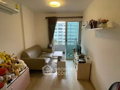 Cozy living room with modern decor and balcony view in urban apartment