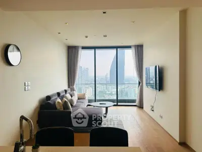 Modern living room with panoramic city view and sleek furnishings