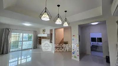 Spacious modern living room with stylish lighting and staircase