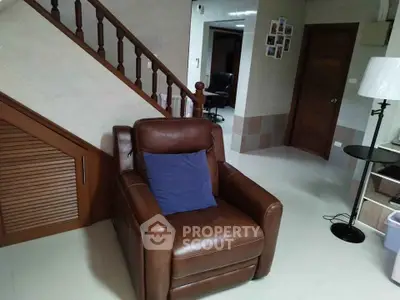 Cozy living room with leather armchair and modern decor