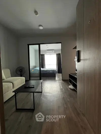 Modern apartment interior with cozy living room and bedroom view