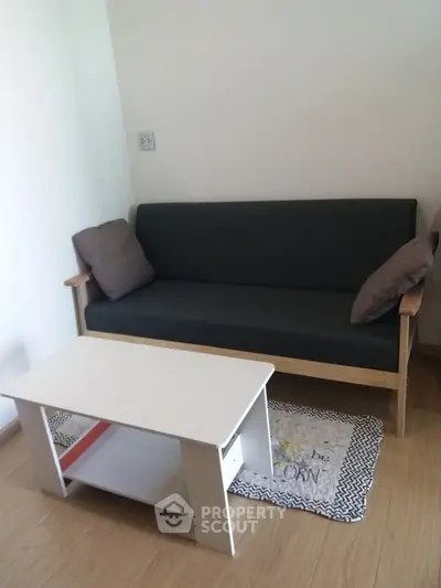 Cozy living room with modern sofa and coffee table on wooden floor
