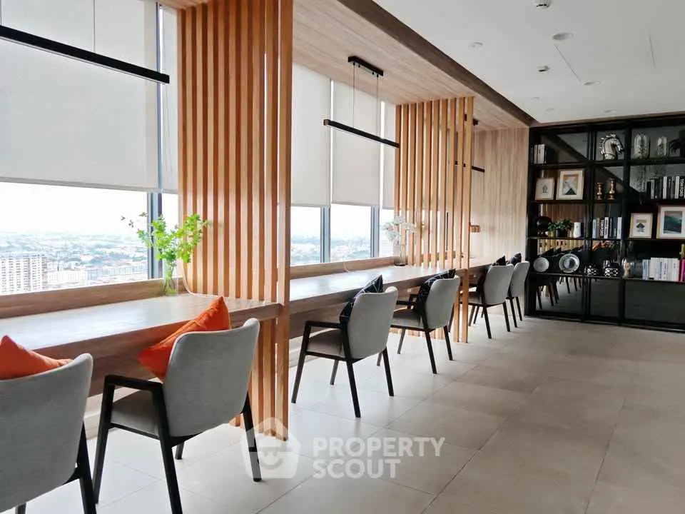 Modern co-working space with panoramic city views and stylish decor