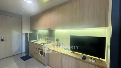 Modern kitchen with sleek cabinetry and built-in appliances in a stylish apartment.