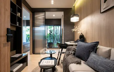 Modern living room with stylish decor and open view to bedroom