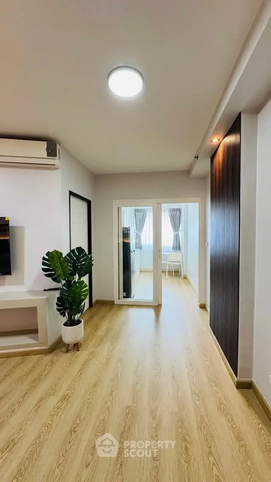 Modern living room with wooden flooring and stylish decor