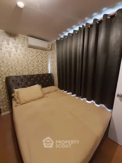 Cozy bedroom with elegant wallpaper and blackout curtains for a restful sleep.