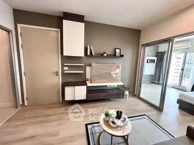 Modern living room with stylish decor and open layout leading to a bedroom with city view.