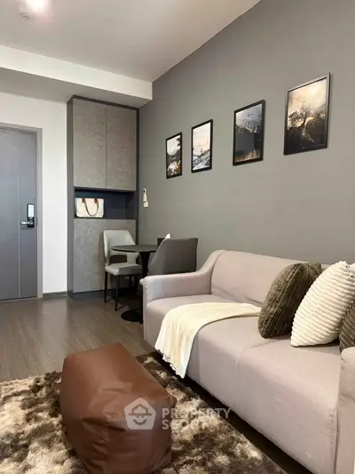 Modern living room with stylish decor and cozy seating area, perfect for relaxation and entertaining.