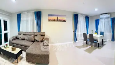 Spacious modern living room with elegant dining area and stylish decor