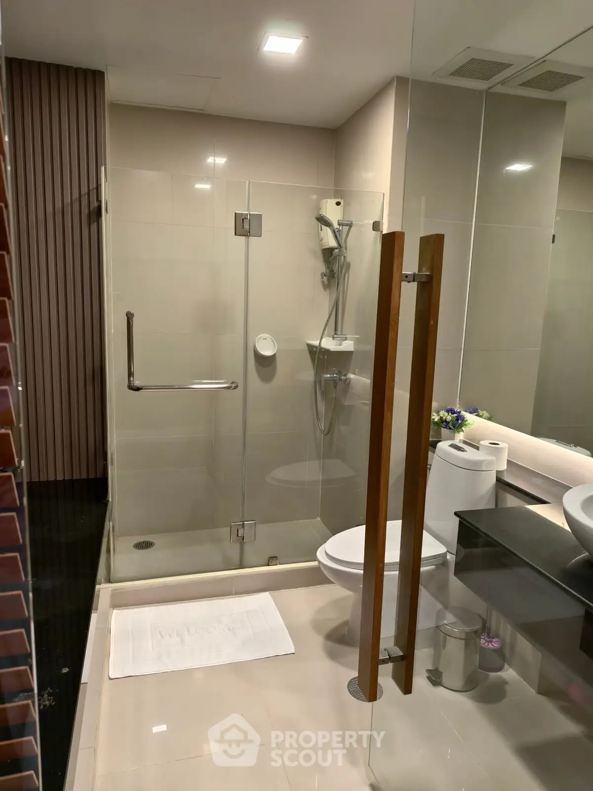 Modern bathroom with glass shower and sleek fixtures