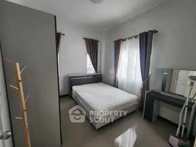 Modern bedroom with sleek furniture and natural light