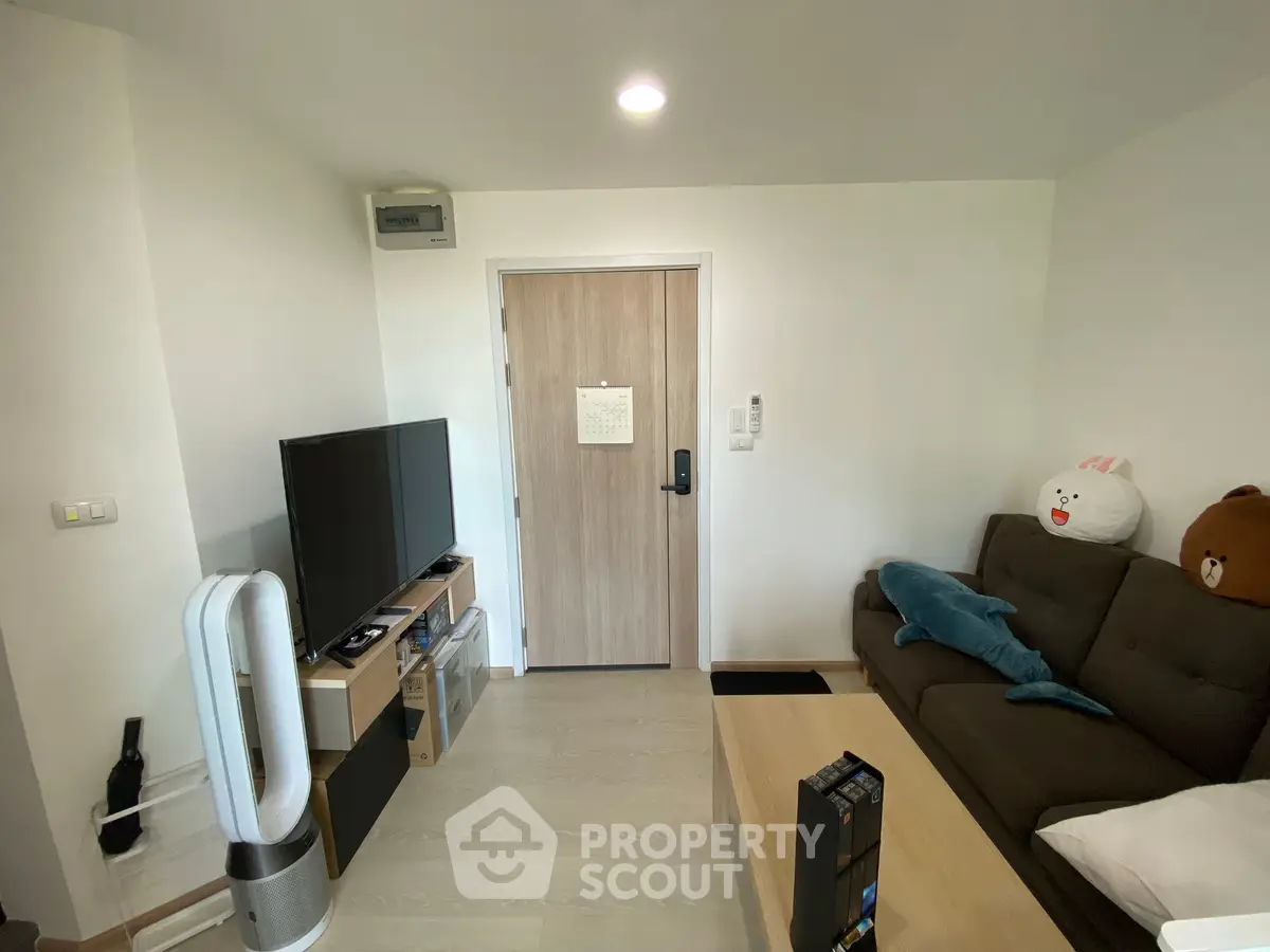 Cozy living room with modern decor and plush seating, perfect for relaxation and entertainment.