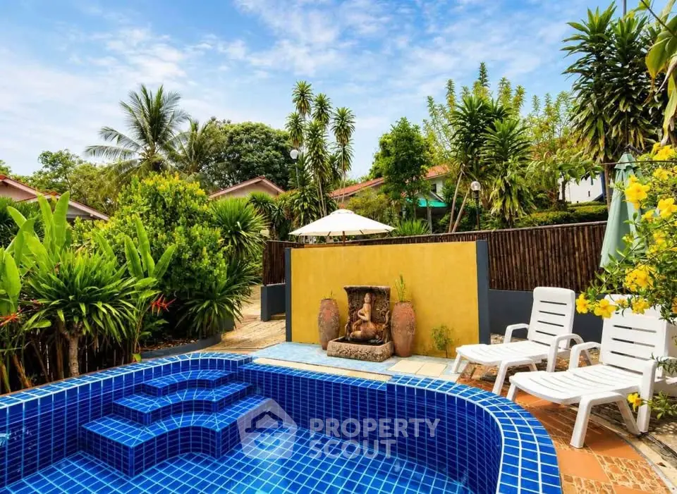 Stunning tropical pool area with lush greenery and modern design, perfect for relaxation and leisure.