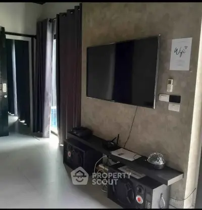 Modern living room with wall-mounted TV and stylish decor