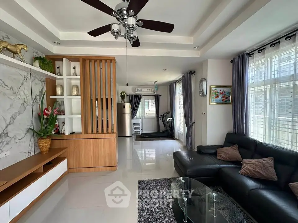 Spacious modern living room with elegant decor and natural light
