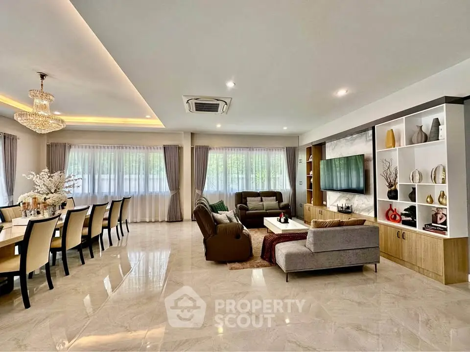 Spacious modern living and dining area with elegant decor and ample natural light.