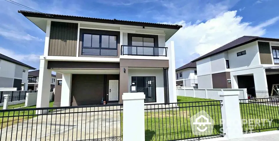 Modern two-story house with sleek design and spacious driveway in a serene neighborhood.