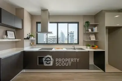 Modern kitchen with sleek cabinetry and city view, featuring open layout and built-in appliances.