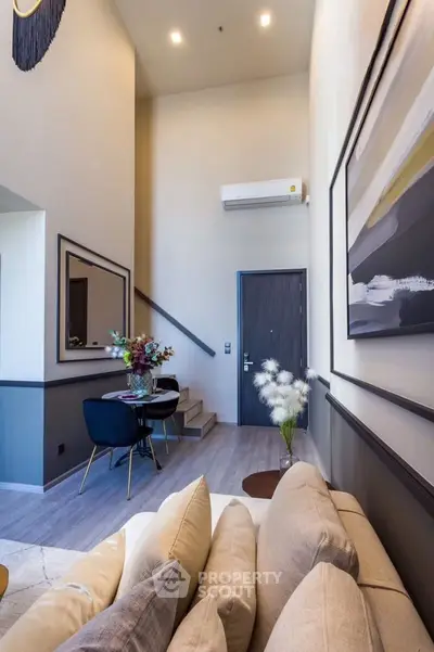 Modern living room with high ceiling and stylish decor