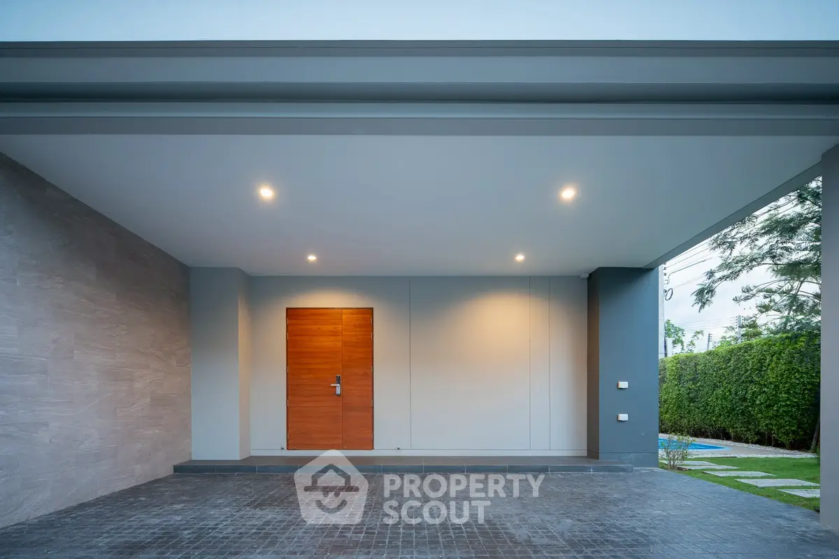 Modern garage entrance with sleek design and ambient lighting