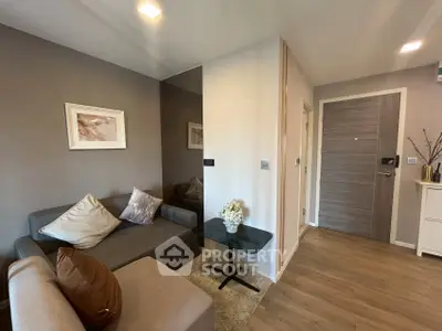 Modern living room with cozy sofa and stylish decor in a contemporary apartment.