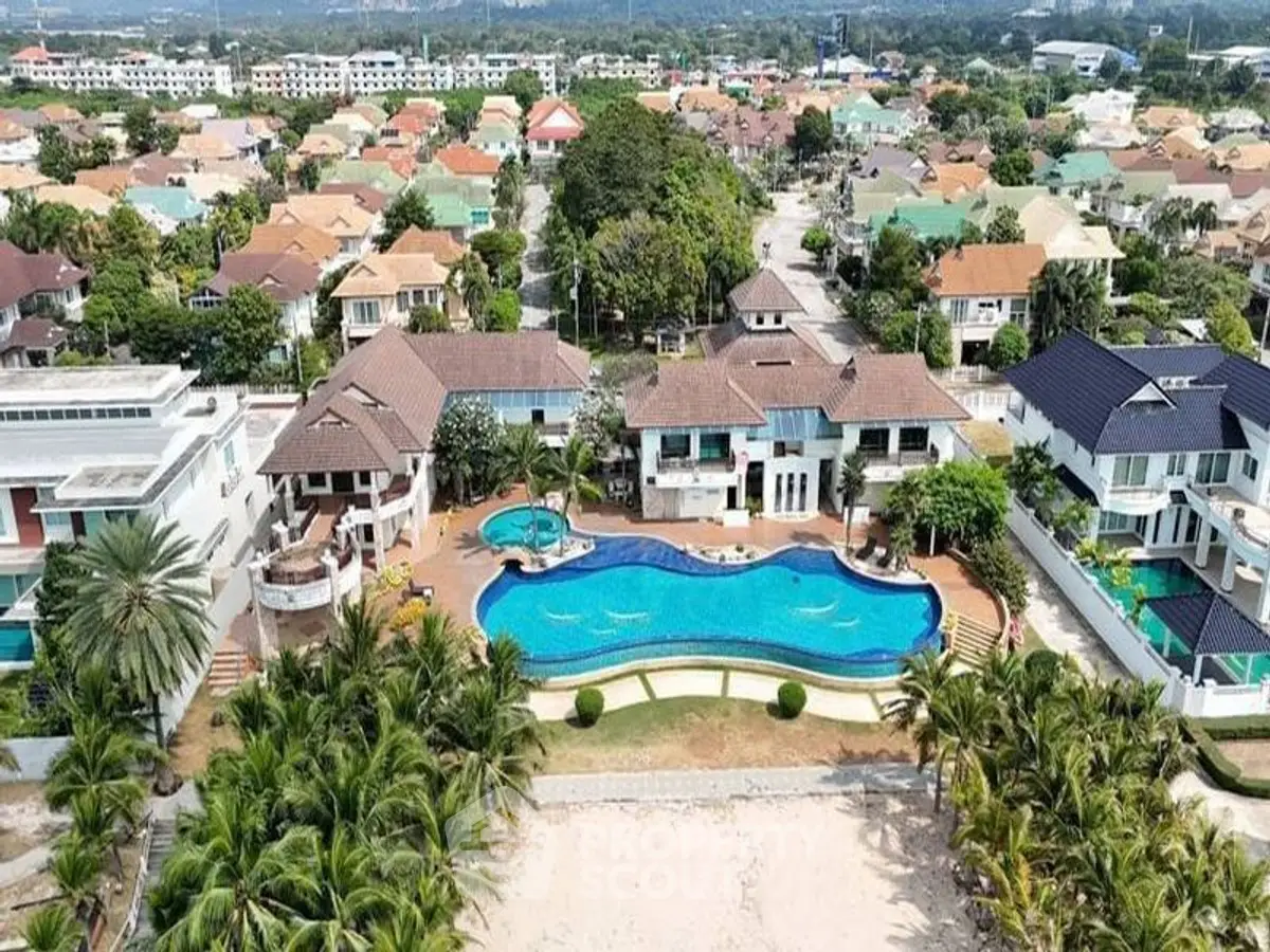 Luxurious beachfront villas with private pool and stunning ocean view in a serene neighborhood.