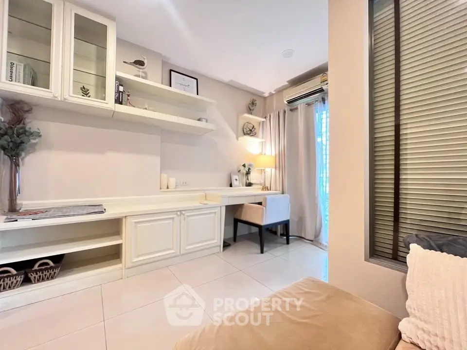 Charming living room with elegant built-in shelves and cozy seating area