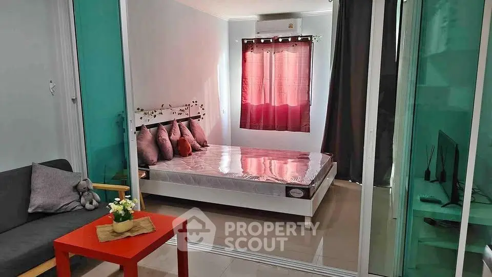 Cozy bedroom with modern decor and natural light, featuring a comfortable bed and stylish furnishings.