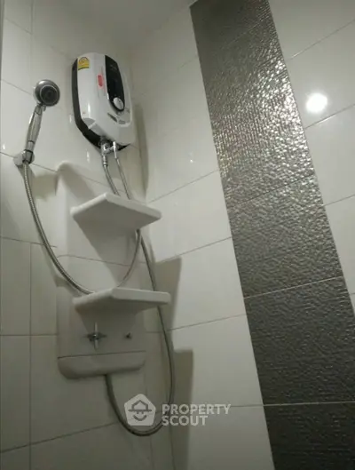 Modern bathroom with sleek shower unit and stylish tile design