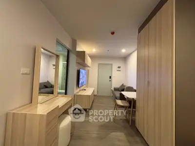 Modern living room with sleek wooden furniture and cozy seating area