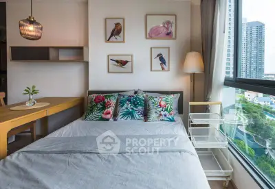 Bright bedroom with large window and colorful decor in modern apartment